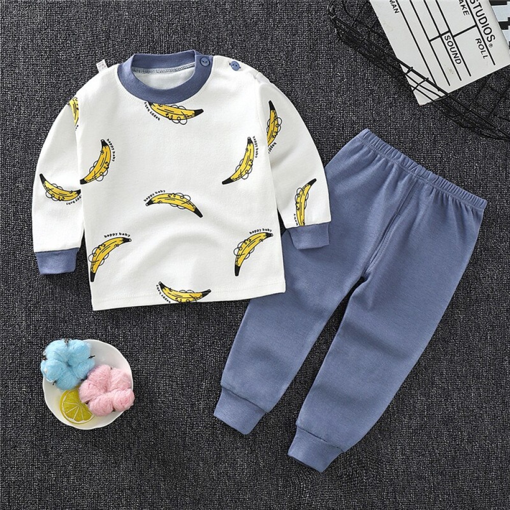 Bomullspyjamas med bananmönster för barn på en mycket högkvalitativ och modern matta